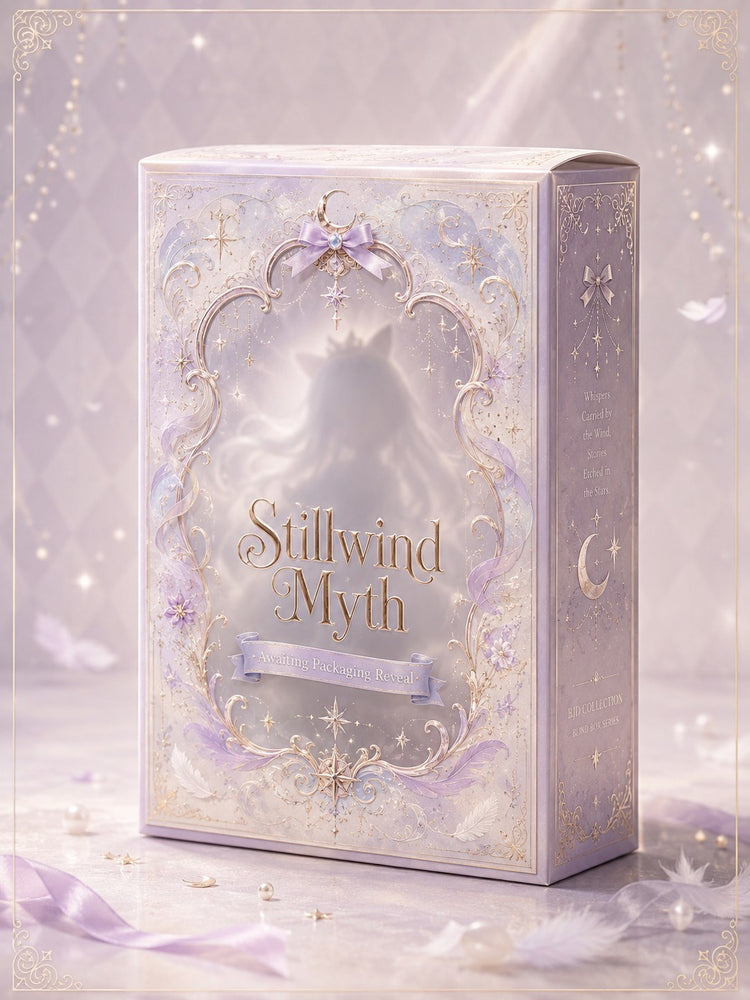 Stillwind Myth — packaging cover, lilac and silver ornamental box with crescent-moon and feather motifs